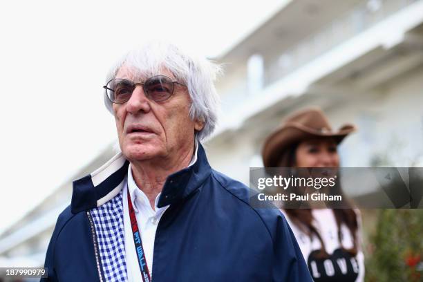 Supremo Bernie Ecclestone and his wife Fabiana Flosi arrive in the paddock during previews to the United States Formula One Grand Prix at Circuit of...