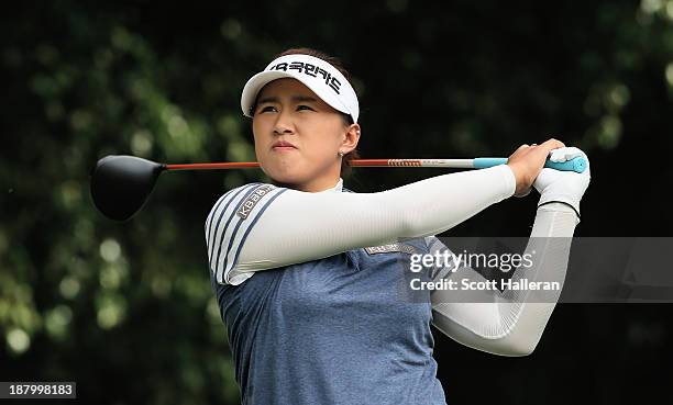 Amy Yang of South Korea watches her tee shot on the fourth hole during the first round of the Lorena Ochoa Invitational Presented by Banamex and...