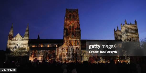 Light installation called Crown of Light, featuring illuminated manuscripts from the Lindisfarne Gospels is projected onto the side of Durham...