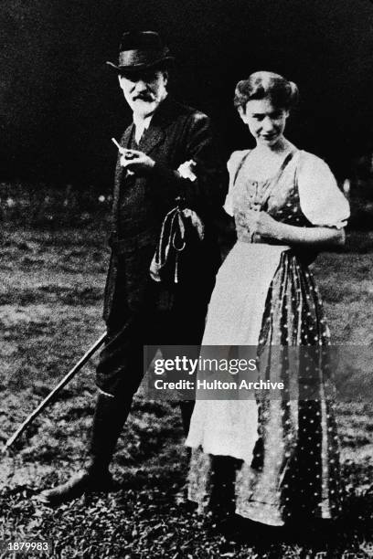 Austrian psychoanalyst Dr. Sigmund Freud walks outdoors with his daughter Anna while on a trip in the Dolomite mountain range, 1912.