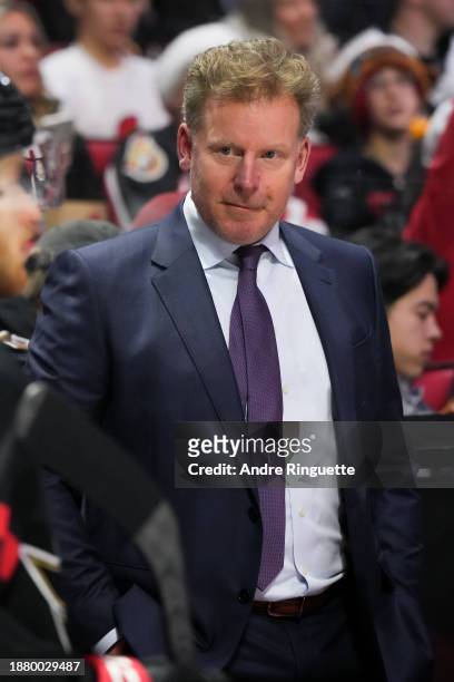 Daniel Alfredsson, assistant coach for the Ottawa Senators, looks on from the bench during an NHL game against the Pittsburgh Penguins at Canadian...