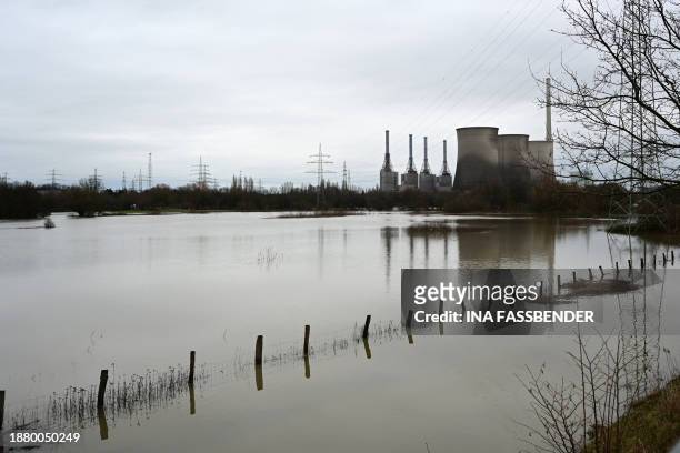 An aerial view taken on December 27, 2023 shows a decommissioned large coal-fired power plant by energy supplier RWE at the flooded Lippe river in...