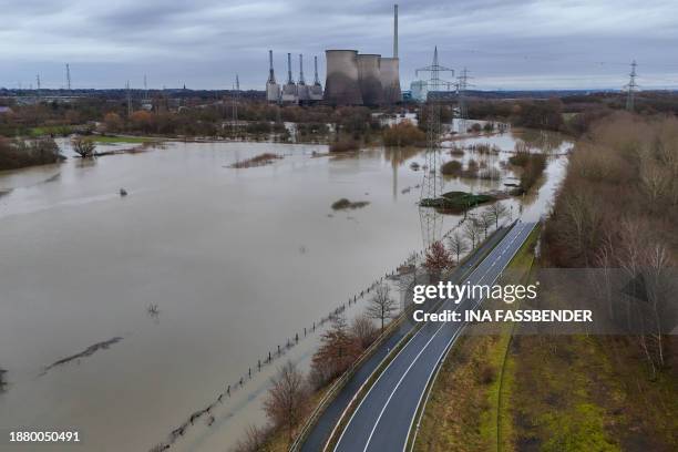 An aerial view taken on December 27, 2023 shows a decommissioned large coal-fired power plant by energy supplier RWE at the flooded Lippe river in...