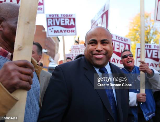 Lawrence Mayor-elect Dan Rivera arrives at a press conference at noon in front of Lawrence City Hall calling for unity, as supporters cheer him on.