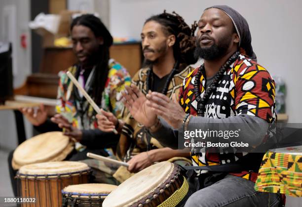 Boston, MA Drummers with "Troupe Fall West African Dance & Drum" perform. They are from left to right: Benjamin Jackson, Aidid Brayboy, and Nko...