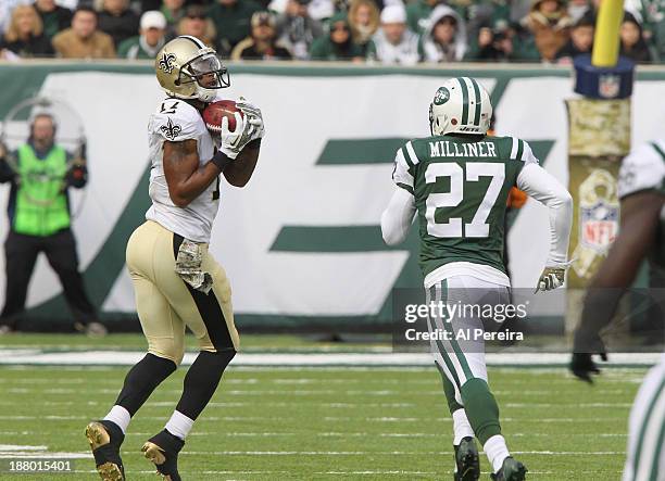 Wide Receiver Robert Meachem of the New Orleans Saints has a long gain against the New York Jets at MetLife Stadium on November 3, 2013 in East...