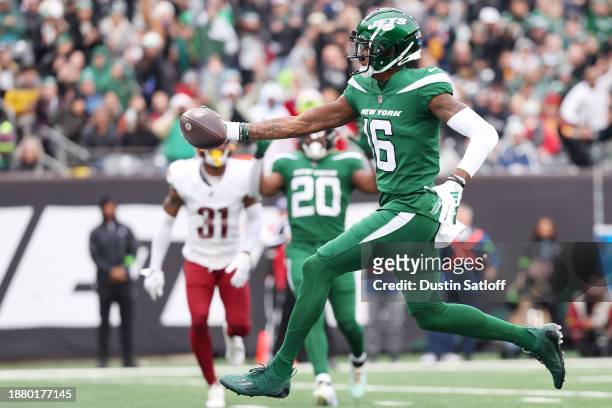 Jason Brownlee of the New York Jets scores a touchdown during the first quarter against the Washington Commanders at MetLife Stadium on December 24,...