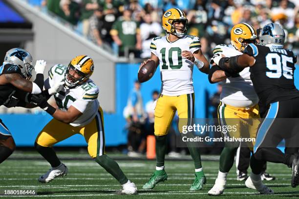 Jordan Love of the Green Bay Packers looks to pass the ball during the first quarter against the Carolina Panthers at Bank of America Stadium on...