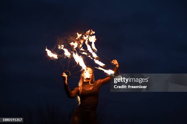 dancing with fire - circus artist stock pictures, royalty-free photos & images