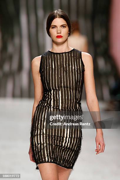 Model walks the runway at the Seam show during Mercedes-Benz Fashion Days Zurich 2013 on November 14, 2013 in Zurich, Switzerland.