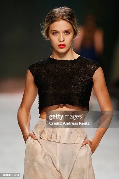 Model walks the runway at the Seam show during Mercedes-Benz Fashion Days Zurich 2013 on November 14, 2013 in Zurich, Switzerland.