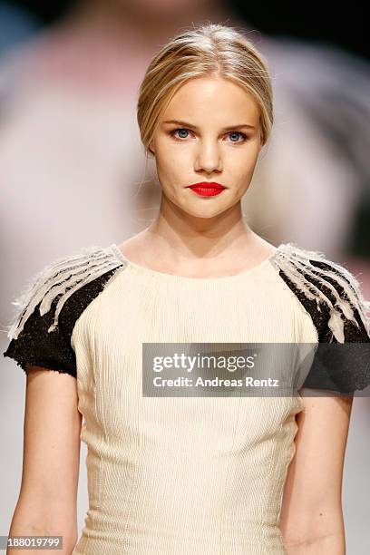 Model walks the runway at the Seam show during Mercedes-Benz Fashion Days Zurich 2013 on November 14, 2013 in Zurich, Switzerland.