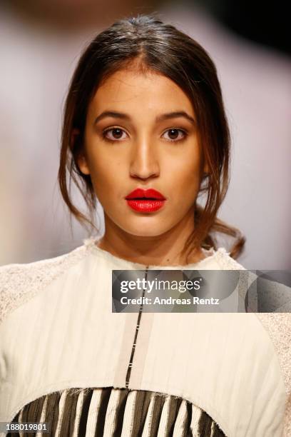 Model walks the runway at the Seam show during Mercedes-Benz Fashion Days Zurich 2013 on November 14, 2013 in Zurich, Switzerland.