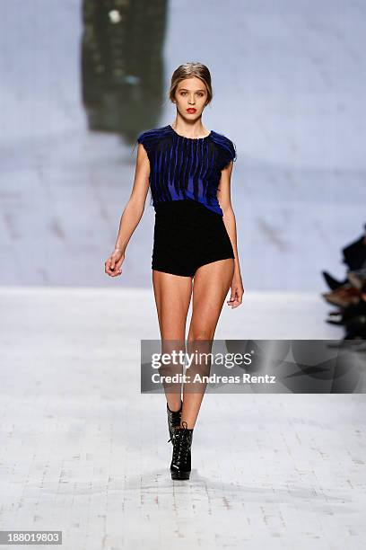 Model walks the runway at the Seam show during Mercedes-Benz Fashion Days Zurich 2013 on November 14, 2013 in Zurich, Switzerland.