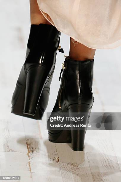 Model walks the runway at the Seam show during Mercedes-Benz Fashion Days Zurich 2013 on November 14, 2013 in Zurich, Switzerland.