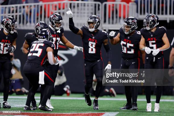 Kyle Pitts of the Atlanta Falcons celebrates after a touchdown during the first quarter in the game against the Indianapolis Colts at Mercedes-Benz...