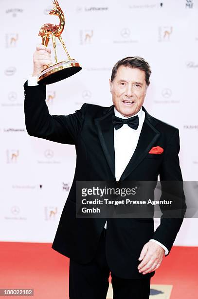 Udo Juergens poses with the Bambi for lifetime achievement at Stage Theater on November 14, 2013 in Berlin, Germany.