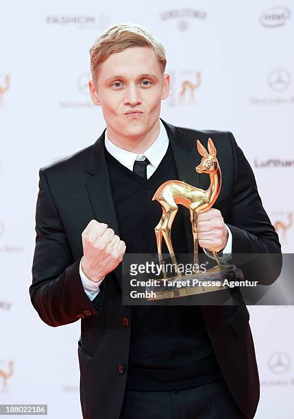 Matthias Schweighoefer poses with the Bambi for best film at Stage Theater on November 14, 2013 in Berlin, Germany.