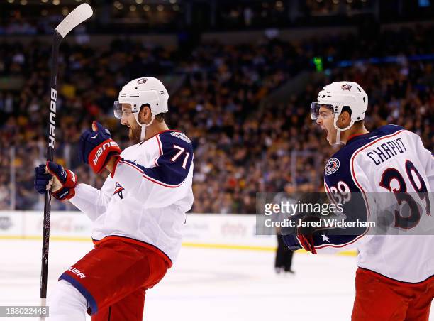 Nick Foligno of the Columbus Blue Jackets celebrates with teammate Michael Chaput following his goal in the second period against the Boston Bruins...