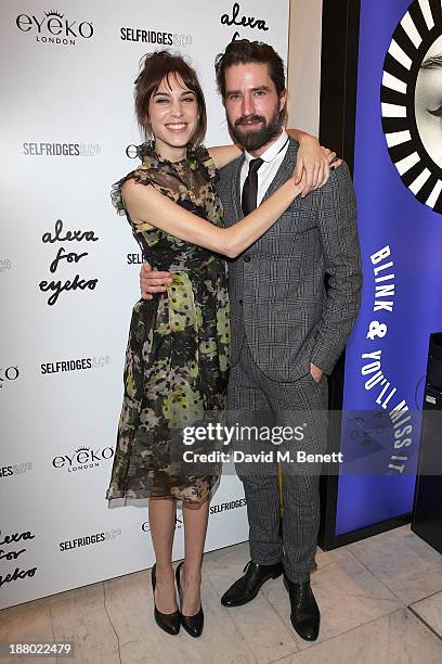 Alexa Chung and Jack Guinness attend the launch of Alexa Chung's new eyeliner and mascara set for Eyeko at Selfridges on November 14, 2013 in London,...