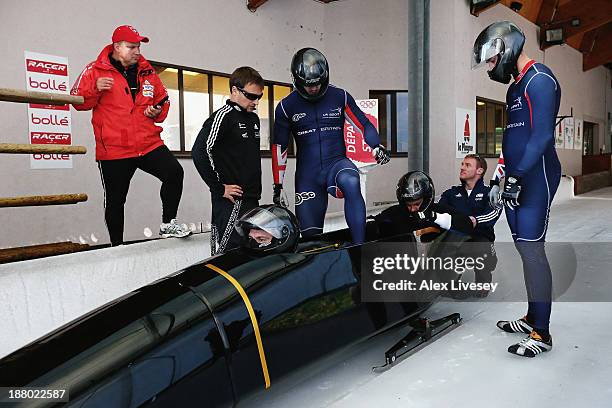 The crew of GBR1, John Jackson, Bruce Tasker, Stu Benson and Craig Pickering of the Great Britain bobsleigh team prepare for a training run at La...