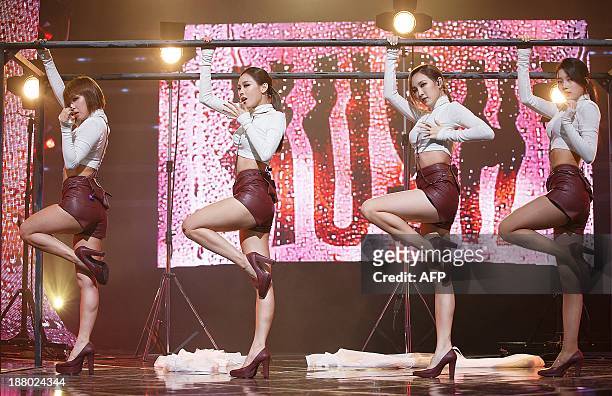 This photo taken on November 14, 2013 shows South Korean idol group "Miss-A" Fei, Jia, Min and Suzy performing at Cable TV music program Mnet...