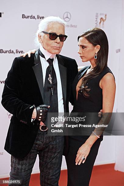 Karl Lagerfeld and Victoria Beckham pose with the Bambi for best fashion at the Bambi Awards at Stage Theater on November 14, 2013 in Berlin, Germany.