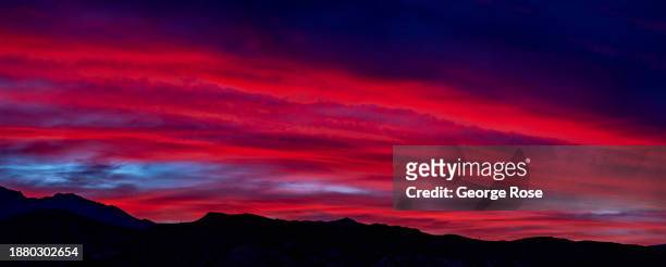 Colorful sunrise is viewed from the iconic overlook at Zabriskie Point on December 15 near Furnace Creek, California. Death Valley National Park, the...