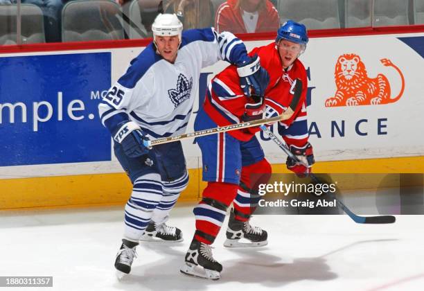 Joe Nieuwendyk of the Toronto Maple Leafs skates against Saku Koivu of the Montreal Canadiens during NHL game action on January 24, 2004 at Bell...