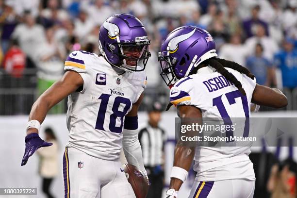 Justin Jefferson of the Minnesota Vikings is congratulated by K.J. Osborn after scoring a touchdown reception against the Detroit Lions during the...