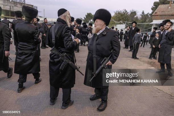 Armed with M16 automatic guns, ultra-Orthodox Jewish men of the Ger Hasidic dynasty and part of the first-response tactical team of their community,...