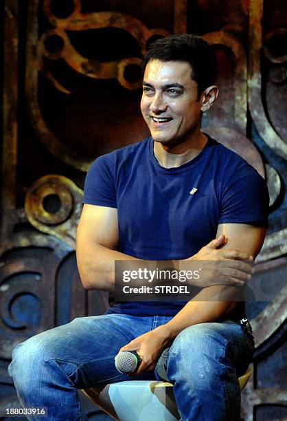 Indian Bollywood actor Aamir Khan poses during the music launch for the forthcoming Hindi film Dhoom 3 in Mumbai late November 14, 2013. AFP PHOTO/STR