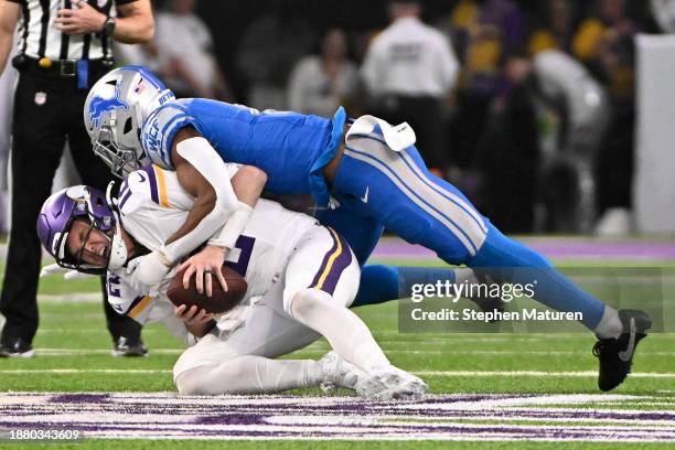 Nick Mullens of the Minnesota Vikings is sacked by Ifeatu Melifonwu of the Detroit Lions during the second quarter at U.S. Bank Stadium on December...