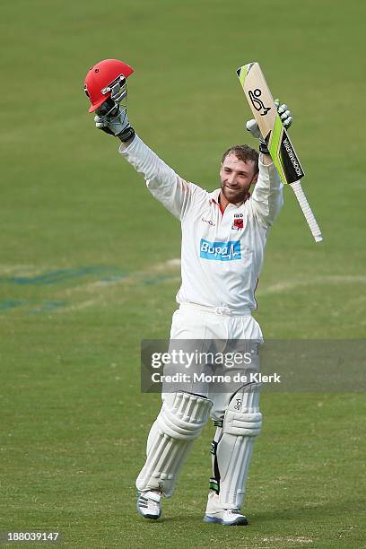 Phillip Hughes of the Redbacks celebrates after reaching 200 runs during day three of the Sheffield Shield match between the Redbacks and the...