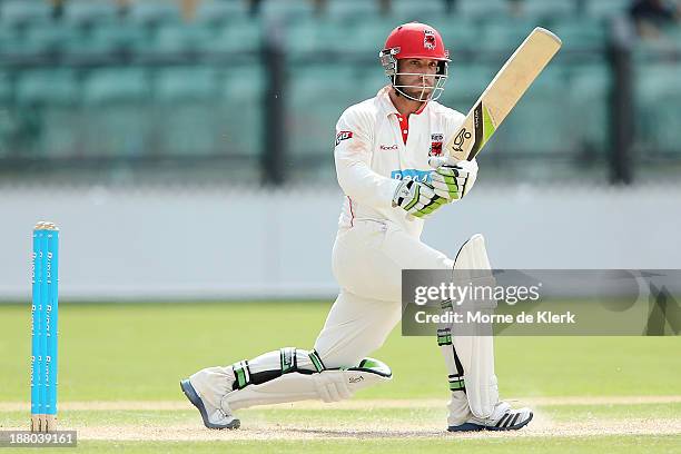 Phillip Hughes of the Redbacks bats during day three of the Sheffield Shield match between the Redbacks and the Warriors at Adelaide Oval on November...