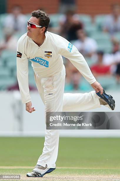 Marcus North of the Warriors bowls during day three of the Sheffield Shield match between the Redbacks and the Warriors at Adelaide Oval on November...