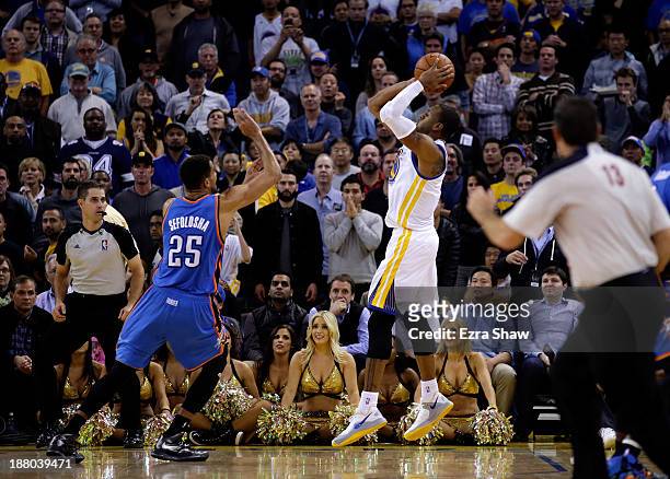 Andre Iguodala of the Golden State Warriors shoots the game winning shot at the buzzer over Thabo Sefolosha of the Oklahoma City Thunder to win the...
