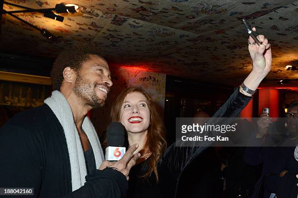 Gary Dourdan and M6 TV journalist Marie Clotilde Ramos Ibanez attend the 'Winter Time 2013' : Cocktail at L'Eclaireur Cafe on November 14, 2013 in...