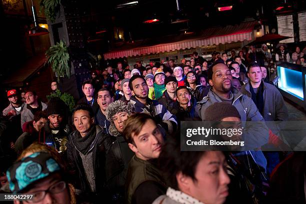 Fans wait in line to attend the Sony PlayStation 4 midnight launch event in New York, U.S., on Thursday, Nov. 14, 2013. Sony Corp., poised to release...