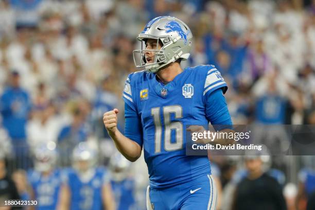 Jared Goff of the Detroit Lions celebrates a touchdown pass against the Minnesota Vikings during the third quarter at U.S. Bank Stadium on December...