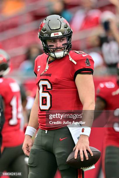 Baker Mayfield of the Tampa Bay Buccaneers warms up prior to the game against the Jacksonville Jaguars at Raymond James Stadium on December 24, 2023...