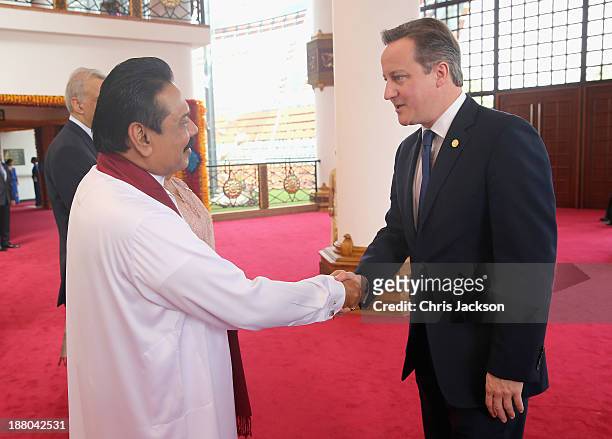 President Mahinda Rajapaksa of Sri Lanka greets British Prime Minister David Cameron ahead of the Commonwealth Heads of Government 2013 Opening...