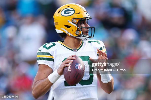 Jordan Love of the Green Bay Packers looks to throw a pass during the fourth quarter against the Carolina Panthers at Bank of America Stadium on...