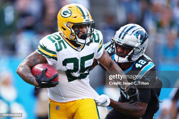 Keisean Nixon of the Green Bay Packers is tackled by Sam Franklin Jr. #42 of the Carolina Panthers during the fourth quarter at Bank of America...