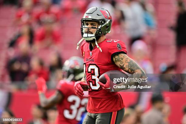 Mike Evans of the Tampa Bay Buccaneers warms up prior to the game against the Jacksonville Jaguars at Raymond James Stadium on December 24, 2023 in...