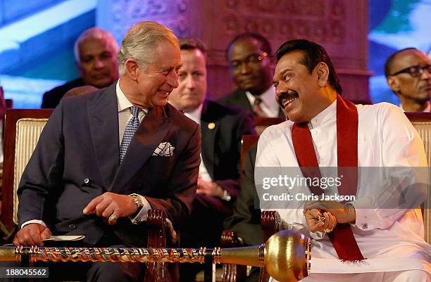 President Mahinda Rajapaksa of Sri Lanka laughs with Prince Charles, Prince of Wales as British Primeminister David Cameron looks on during the...
