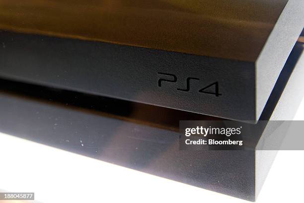 Sony PlayStation 4 console stands on display at a Game Stop store during the Sony PlayStation 4 midnight launch event in San Francisco, California,...
