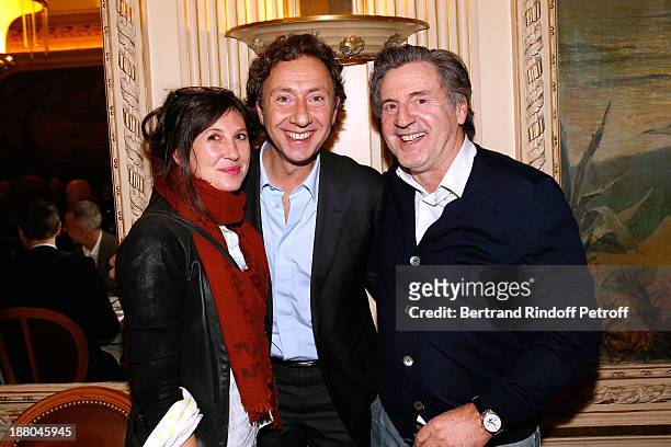 Stephane Bern stands between Daniel Auteuil and his wife Aude Auteuil attend the 50th Anniversary party of Stephane Bern, called "Half a century,...