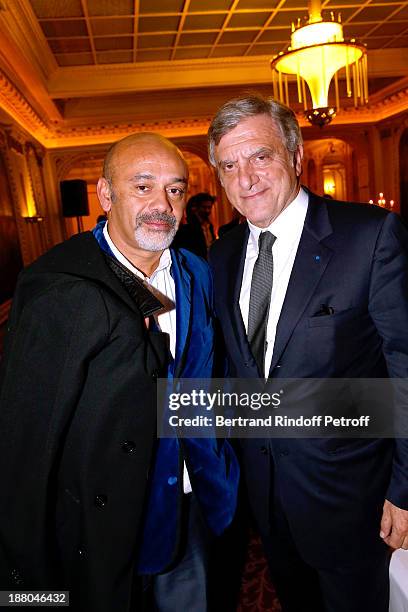 Christian Louboutin and Sidney Toledano attend the 50th Anniversary party of Stephane Bern, called "Half a century, it's party", celebrated at...