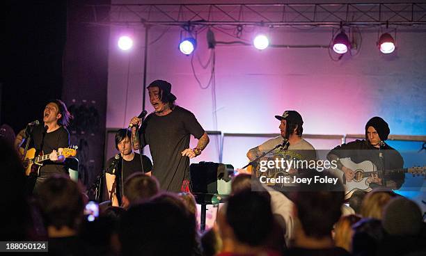 Ron Ficarro, Ryan Seaman, Ronnie Radke,Derek Jones, and Jacky Vincent of Falling In Reverse performs at The Emerson Theater on November 14, 2013 in...